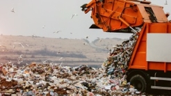 Garbage truck dumping the garbage on a landfill