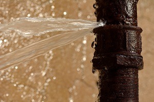 Burst pipe spraying water