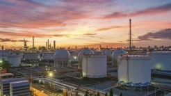 Refinery with a sunset sky in the background