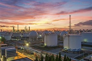 Refinery with a sunset sky in the background