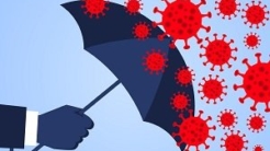 Person holding umbrella to guard against COVID virus