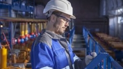 Man in hardhat in a facility