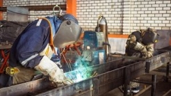 Welder wearing hat and gloves