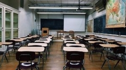 Classroom with desks and map