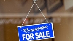 Business for Sale sign hanging in window