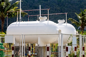 White storage Natural Gas Tank on day noon light for small factor.