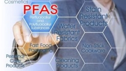 Person pointing to the word PFAS