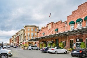 Strip mall with cars in parking lot