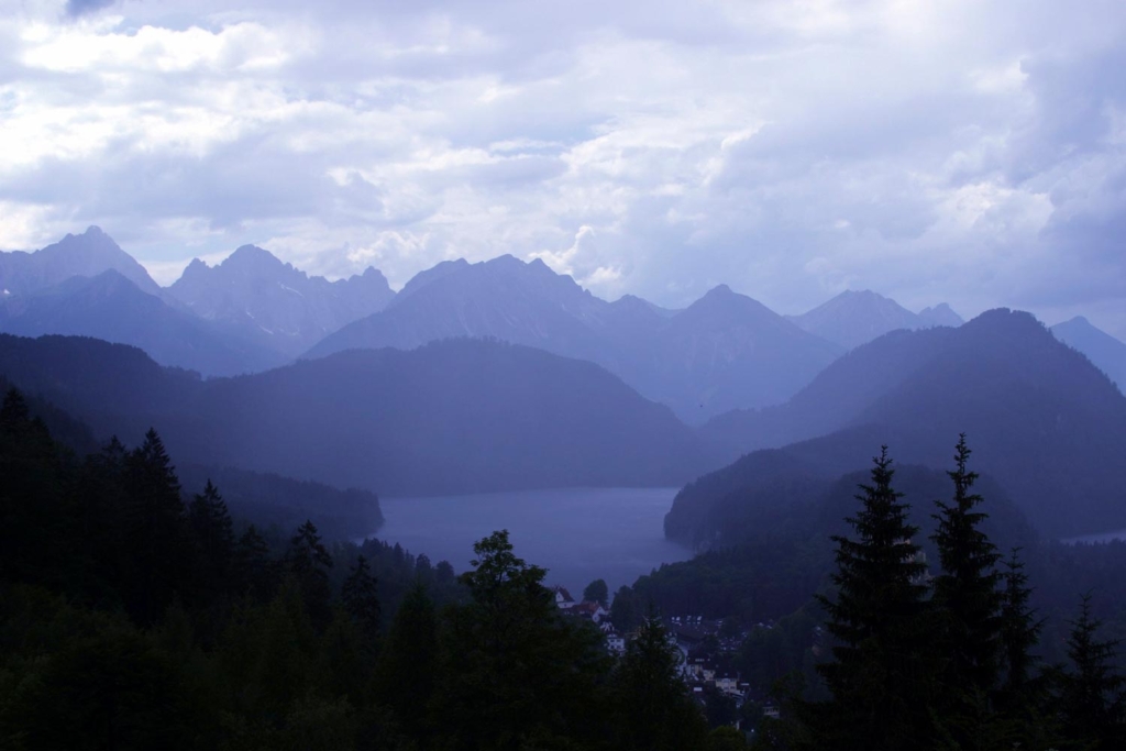 Blue foggy mountains with lake