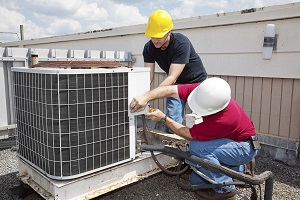 HVAC Contractors fixing AC system